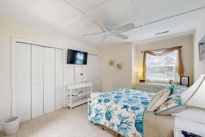 a bedroom with a bed and a ceiling fan at Mallard Lakes - 38082 Mockingbird Ln in Selbyville +25 photos