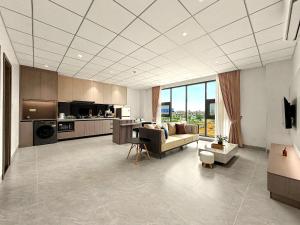 a large living room with a couch and a kitchen at Modera Residence Grand Phnom Penh, Serviced Apartments in Phnom Penh