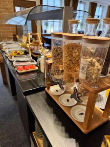 a buffet line with many different types of food at Hotel Hinz in Bad Oldesloe +11 photos