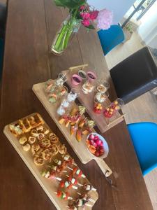 a table with a bunch of different types of food at Les Terres Noires in Serville +12 photos
