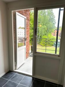 an open door with a view of a balcony at Lägenhet Svängsta in Svängsta