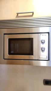 a microwave oven sitting on top of a counter at Vigo a un paso in Vigo +32 photos