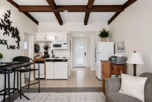 a kitchen and living room with white appliances at Poolside Retreat at Kimberling Crossing in Kimberling City