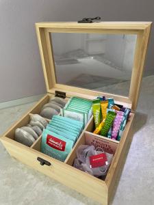 a wooden box filled with different types ofaments at Studio de plein pied avec terrasse in Joncherey