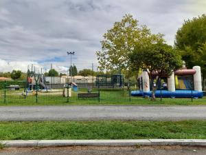 a park with a playground with a slide at danseuse 33 in Parentis-en-Born