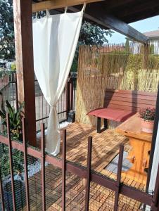 a patio with a table and an umbrella at La volpe e l'uva in Lavagno