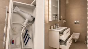 a bathroom with a white sink and a toilet at Aura Home in Grywałd +70 photos