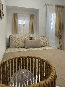 a bedroom with a large bed with a window at Katsaras Sunset & Pool House in Kremasti +37 photos