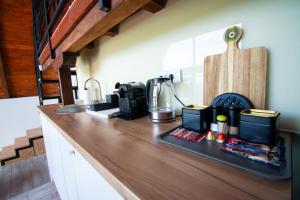a kitchen with a counter top with a coffee maker at Kosmaj Escape in Koraćica +31 photos