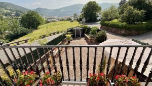 a balcony with a view of a garden with flowers at Matxiku Aurre in Berástegui