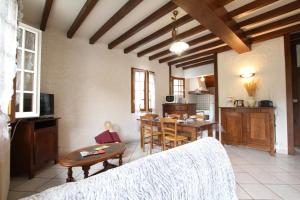 a living room with a table and a kitchen at Iagonia in Lacarry-Arhan-Charritte-de-Haut
