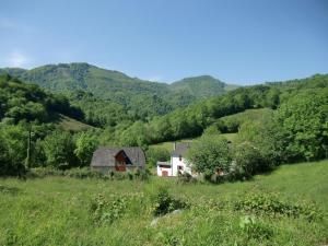 a house in a field with mountains in the background at Iagonia in Lacarry-Arhan-Charritte-de-Haut +23 photos