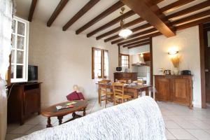 a living room with a table and a kitchen at Iagonia in Lacarry-Arhan-Charritte-de-Haut