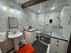a white bathroom with a sink and a toilet at Lakeview 4BR Huge Deck Dog Friendly ADA in Lakeside +58 photos