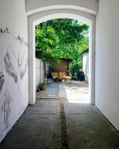 an empty hallway with an open door to a yard at Apartament rodzinny SAKURA in Jędrzejów +8 photos