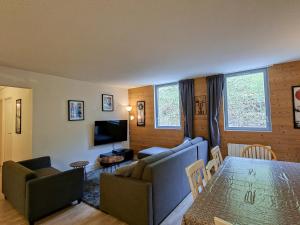 a living room with a couch and a table at Spacieux appartement 3 pièces au centre de Flaine - FR-1-425-28 in Flaine