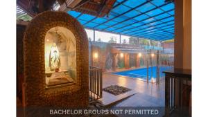 an archway in a house with a swimming pool at Jonirene Seasands Homestay in Alleppey