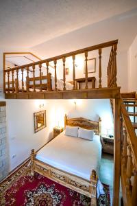 a bedroom with a bunk bed and a staircase at Hotel Gjirokastra in Gjirokastër +86 photos