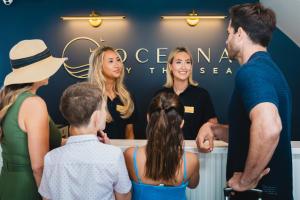 a group of people standing around a counter talking at Oceana By The Sea in Point Pleasant Beach +68 photos