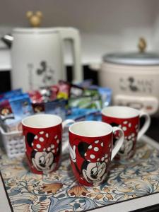 three coffee cups sitting on a counter with food at Hope residences 501 building b in Trece Martires
