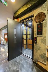 an open door in a room with a wall at Astro Suites in Istanbul