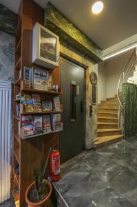 a hallway with a book shelf and a staircase at Astro Suites in Istanbul