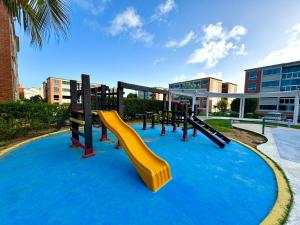 a playground with a slide in the water at Coral Suite Excellent location in Porlamar