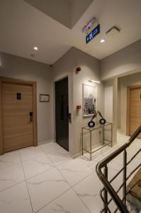 a lobby with two doors and a clock on the ceiling at Astro Suites in Istanbul +31 photos
