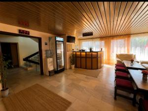 a living room with a couch and a table at Hotel Olimpiya in Balchik