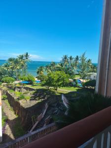 a view of the ocean from the balcony of a resort at Ocean View Apartment D5 in Mombasa