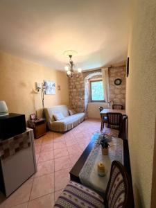 a living room with a couch and a table at Tetka Apartments in Kotor