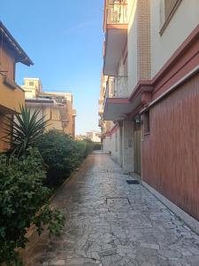 an alley way between buildings in a city at Solaris Guest House in Ciampino