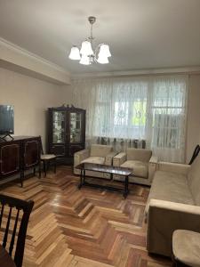 a living room with a couch and a table at Tumo cozy corner in Yerevan