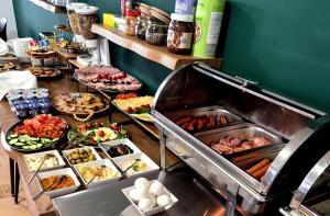a buffet line with many different types of food at SunRiviera Mamaia Nord in Mamaia Sat/Năvodari