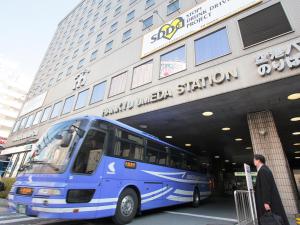 a blue double decker bus parked in front of a building at Hotel New Hankyu Osaka in Osaka