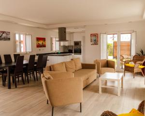 a living room with a couch and a table at Maria's Village in Tavira