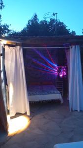 a bed under a canopy in a room with lights at Vega Fuente de las Moreras in Burunchel