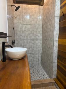 a bathroom with a sink and a shower at Solarte EcoLodge in The Gap