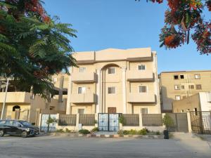 a building with a car parked in front of it at Villa131 Hotel in Cairo