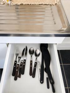 a drawer filled with utensils in a kitchen at El Rincón de km8 in Comodoro Rivadavia