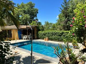 a swimming pool in front of a house at Vega Fuente de las Moreras in Burunchel