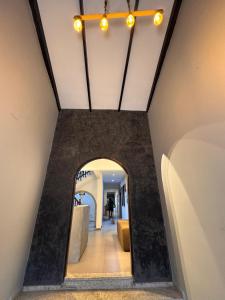 a hallway in a building with a ceiling with lights at Sarao in Santa Cruz de la Sierra +22 photos
