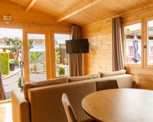 a living room with a couch and a table at Maria's Village in Tavira