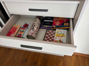 a drawer in a cabinet filled with books at Alvina 29 in Tsaghkadzor