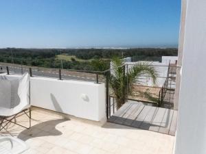 a balcony with a view of the ocean at Tigmi Anis Essaouira Diabat in Essaouira