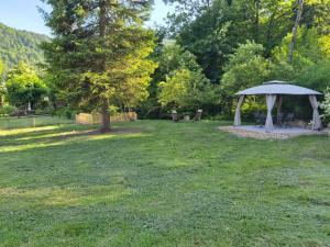 a gazebo in the middle of a yard at Apartments Lian in Bled