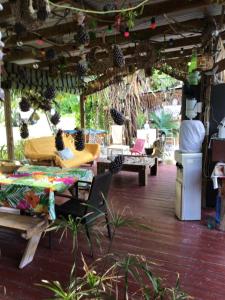 a room with couches and a table at Tureva lodge in Tiputa +26 photos