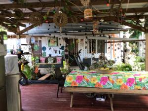 a room with a table with a flowered table cloth at Tureva lodge in Tiputa