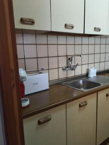 a kitchen with a sink and a counter top at Playa Velilla in Granada