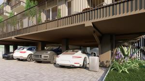 a row of parked cars parked under a building at Hotel Taormina in Bardolino